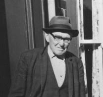 A person in a suit and hat
AI-generated content may be incorrect.